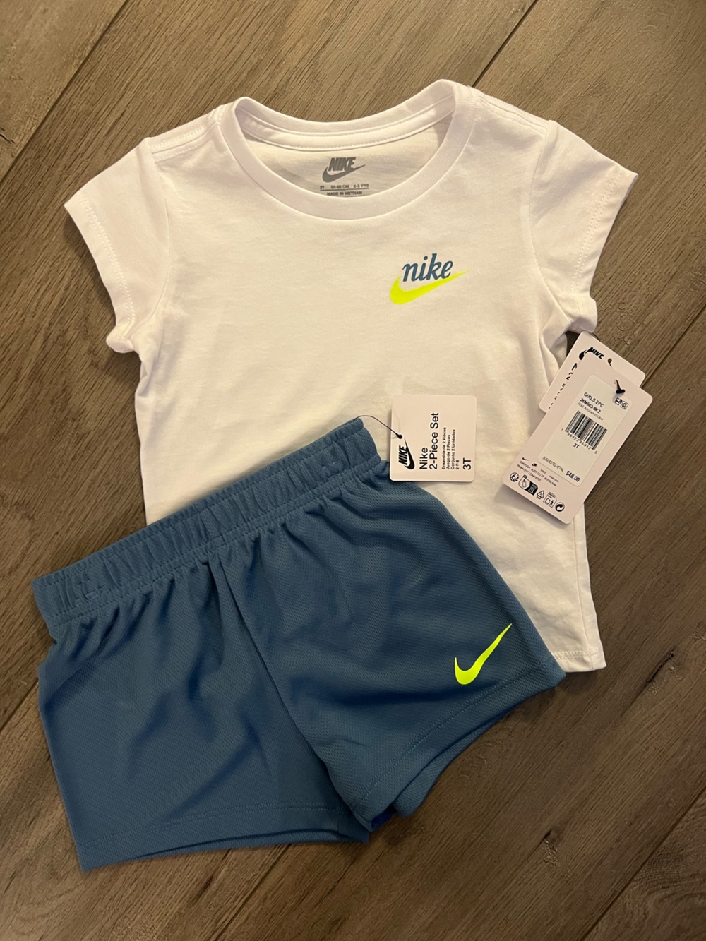 Nike Kids White Tee with Blue Shorts and Neon Yellow Swoosh